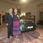 Stirling Moss presents his wife with Aston Cygnet present