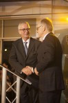 Nicholas Mee (left) shakes hands with Dr. Ulrich Bez