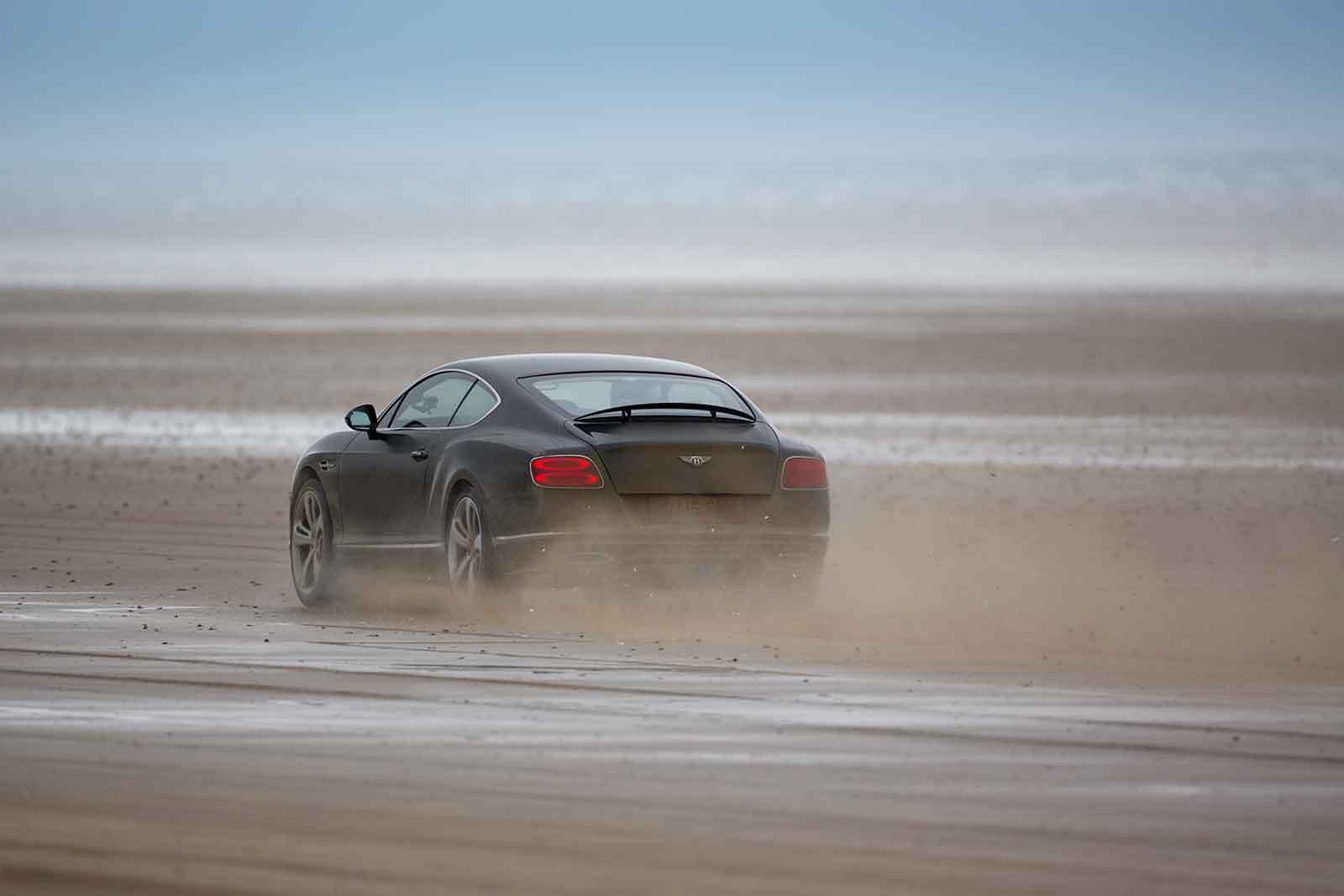 Idris Elba breaks ‘Flying Mile’ at legendary land speed location Pendine Sands in Bentley Continental GT Speed